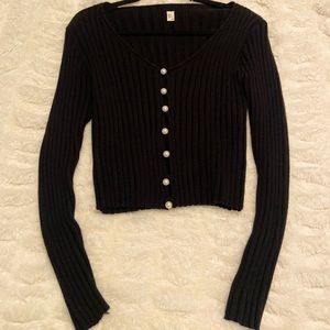Black soft sweater w/ pearl buttons. Size M